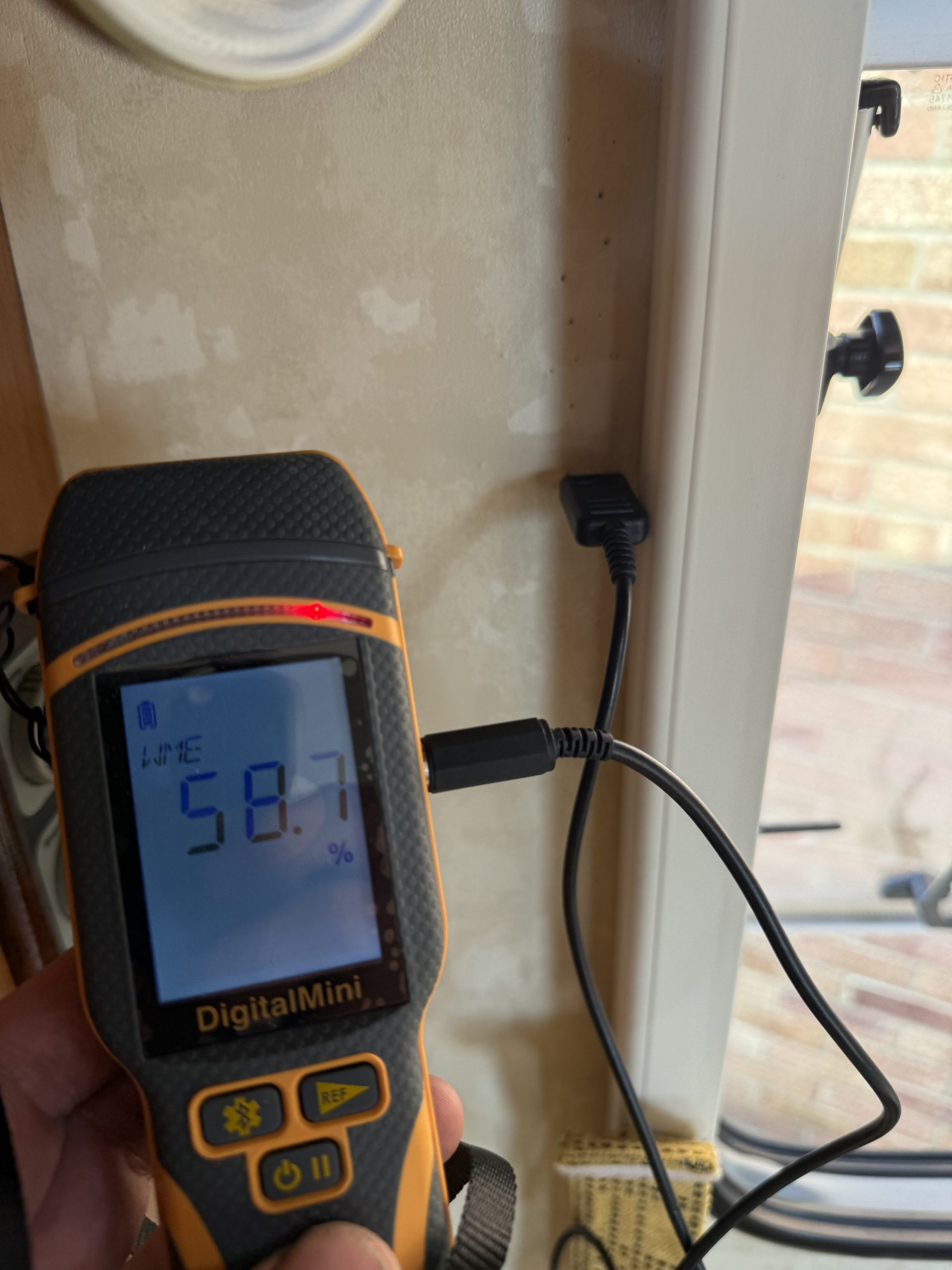 Moisture meter showing 58.7 percent WME
