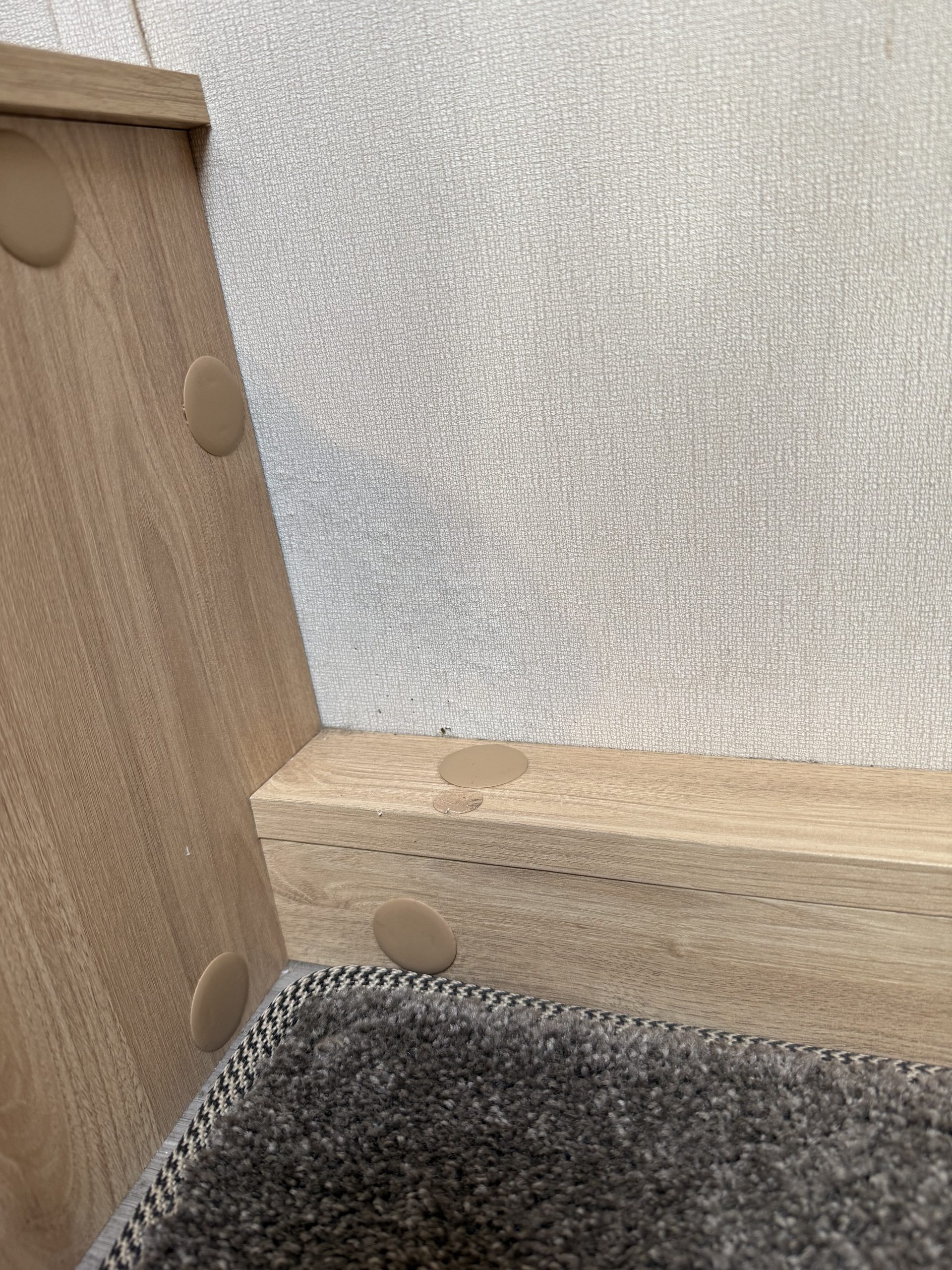 Subtle dark spotting on caravan wall near furniture